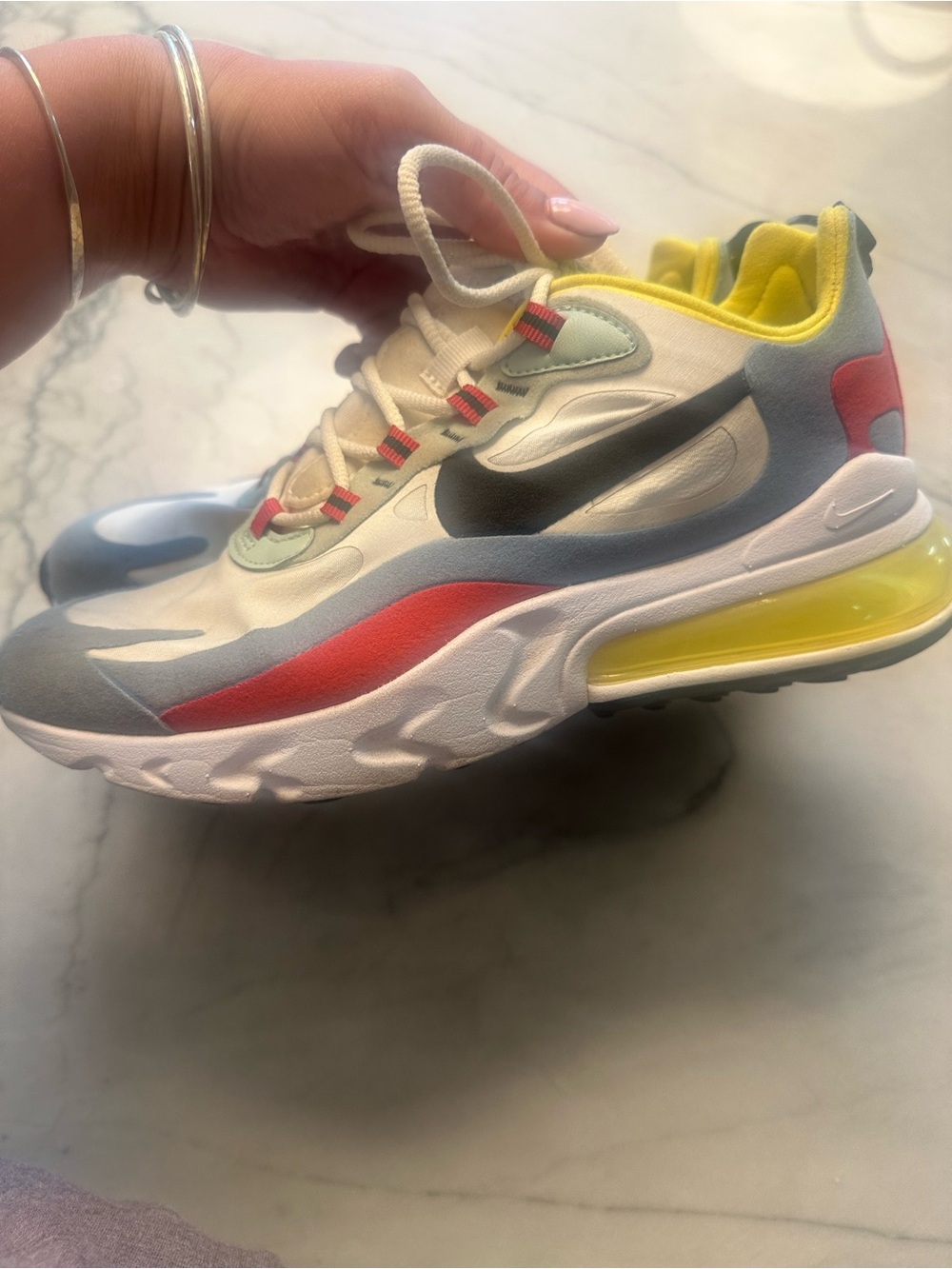 Nike sneaker in Yellow, Cream, Gray with Coral accents